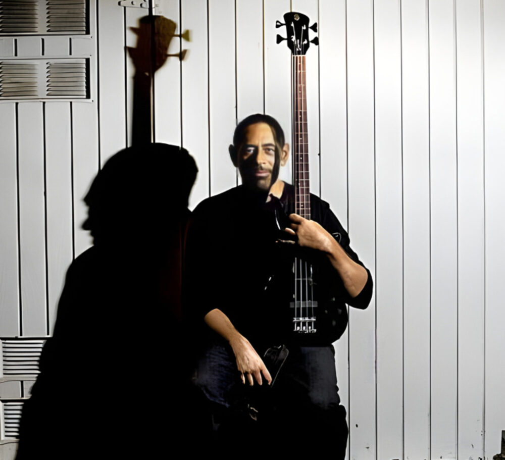 Bass Player Robin Duhe holding his bass